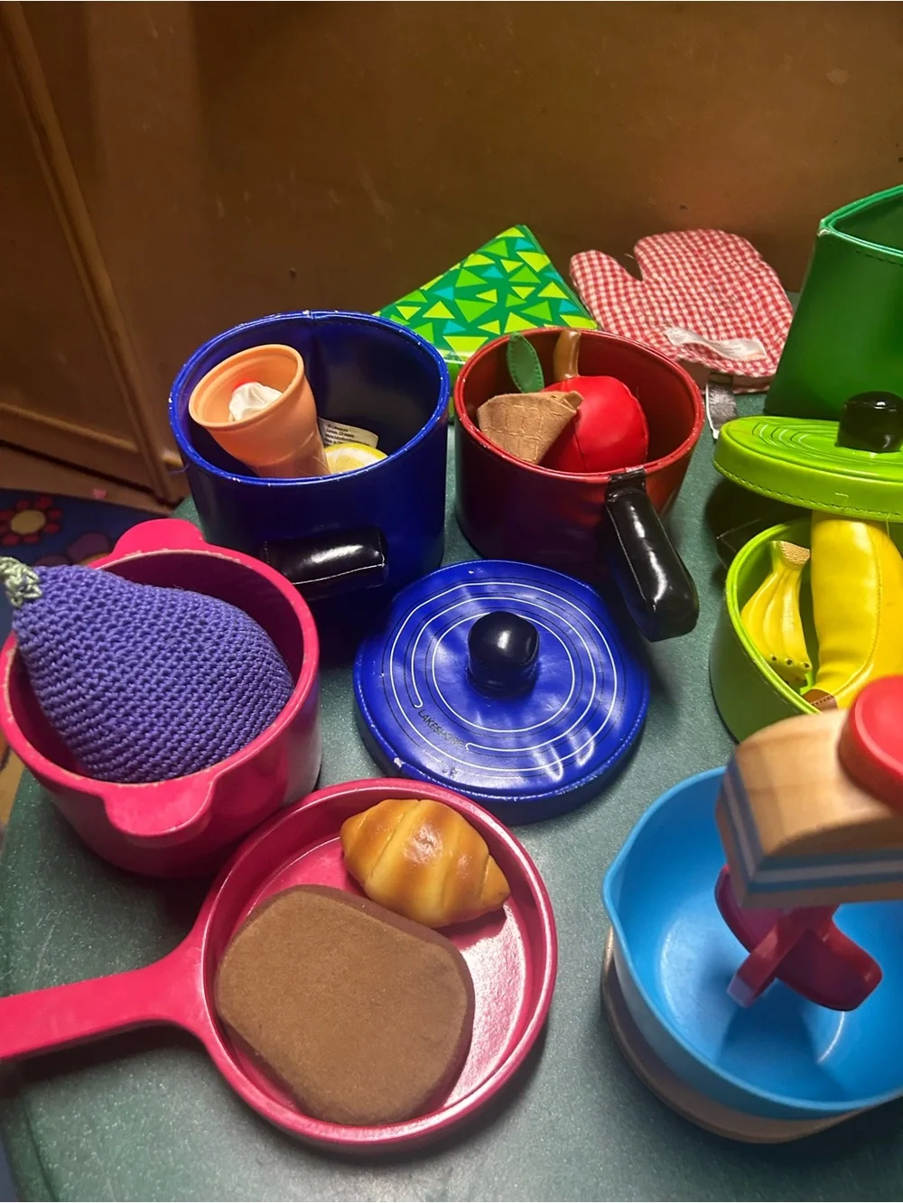 Kitchen play- colorful pans, food and wooden mixer